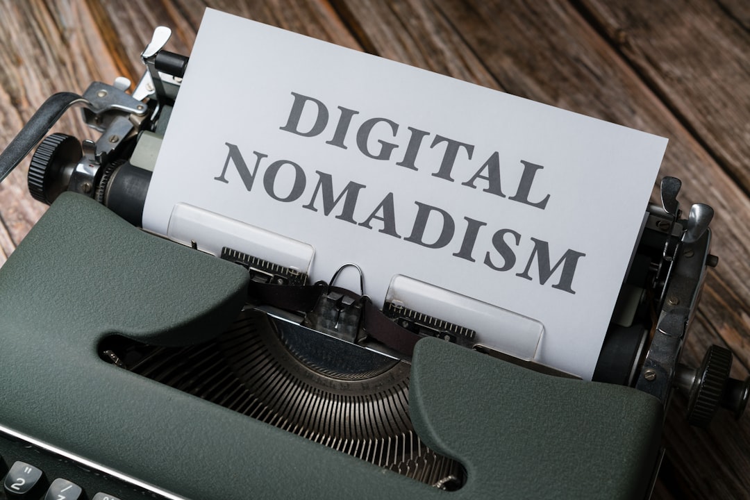 a-close-up-of-a-typewriter-with-a-paper-that-reads-digital-nomadism-yj73d-tf0k4